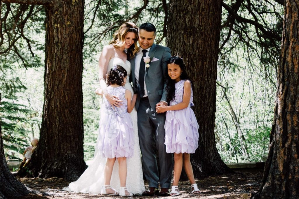 family smiling during outdoor wedding. Colorado wedding venue
