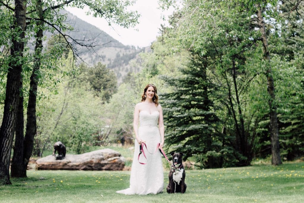 bride poses with dog at Romantic RiverSong