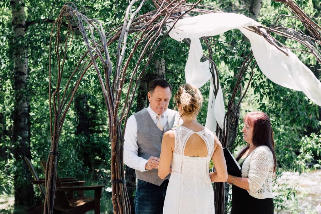 exchanging the rings during outdoor wedding