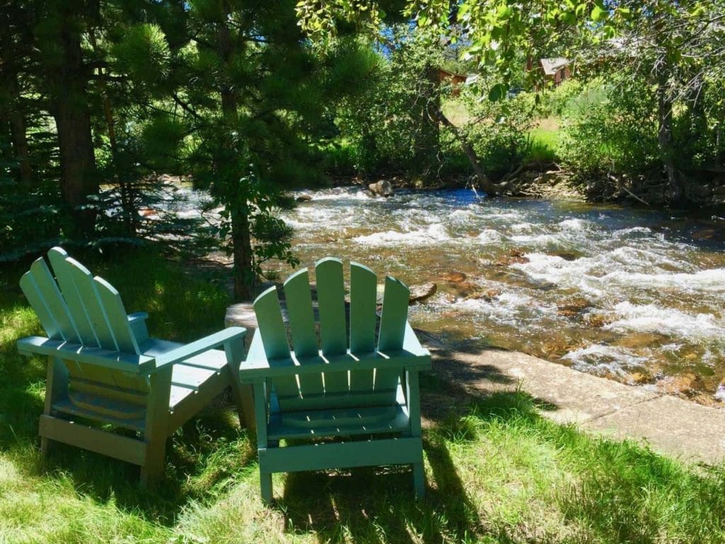 chairs sit by the river for marriage retreat