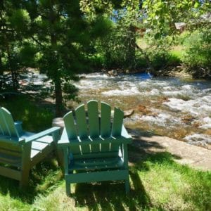 chairs sit by the river