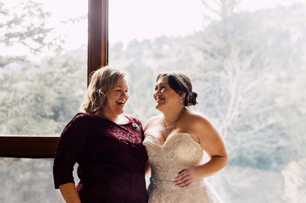 happy bride at romantic riversong Inn colorado wedding venue
