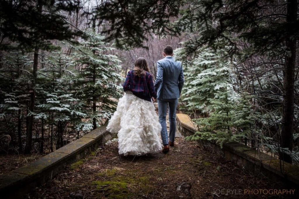 Couple walk through forest