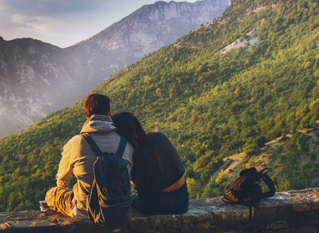 couples on mountain at couples wellness retreat
