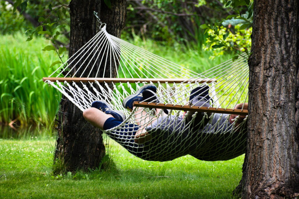 Couple in outdoor hammock swing at B&B