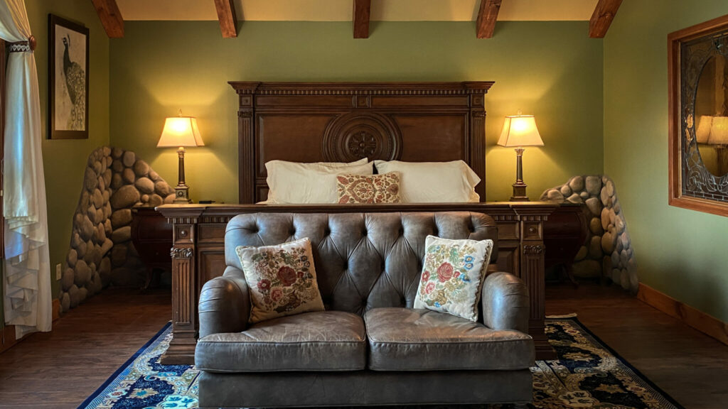 Cozy bed at Romantic RiverSong Inn, Estes Park Getaways